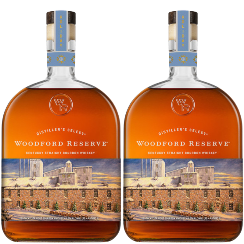 Load image into Gallery viewer, Two bottles of Woodford Reserve Bourbon Holiday Edition 2026 750ml, with a distillery illustration and light blue festive neck labels, are placed side by side.
