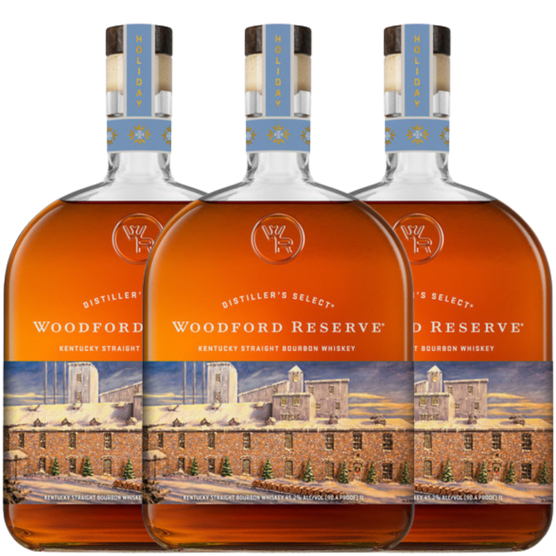 Load image into Gallery viewer, Three bottles of Woodford Reserve are lined up, featuring the Woodford Reserve Bourbon Holiday Edition 2026 750ml with festive labels and a distillery illustration.
