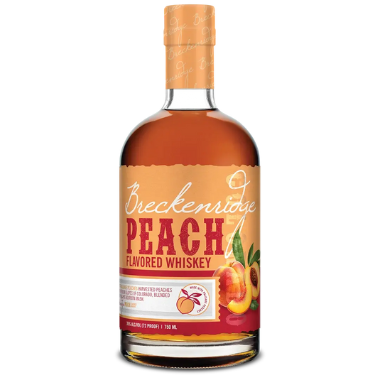 A 750 ml bottle of Breckenridge Peach Whiskey by Breckenridge Distillery, featuring an orange label adorned with images of Palisade peaches and a matching orange cap. This Colorado bourbon is expertly infused with the rich flavor of local peaches.
