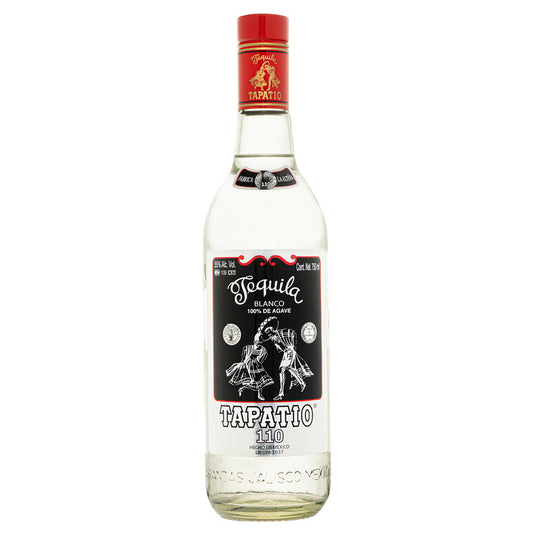 A clear glass bottle of Tapatio High Proof Blanco Tequila, topped with a red cap and adorned with a black and white label featuring two dancers. The label displays “100% de Agave” and “Tapatío 110,” showcasing this highland tequila as an authentic agave spirit. Embodying the bold character of the Tapatio brand, this distinctive bottle of High Proof Blanco Tequila stands out for its authenticity and heritage.