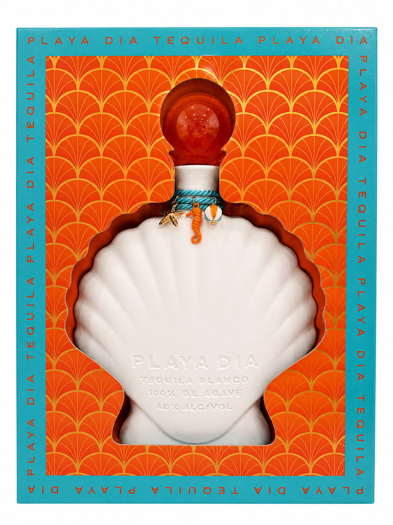 Load image into Gallery viewer, A white, shell-shaped bottle of Playa Dia Blanco Tequila rests in an orange and teal box decorated with a seashell pattern and accented by small sea charms tied around the neck. This 100% Blue Weber agave tequila offers a pure, additive-free blanco character.
