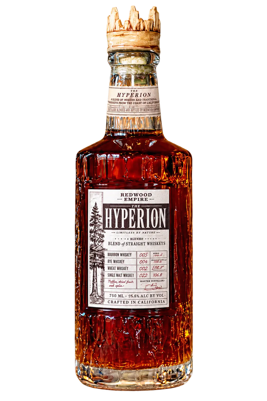A bottle of Redwood Empire The Hyperion Inaugural Batch 001 Blend of Straight Whiskies by Redwood Empire Whiskey, featuring a cork top, amber liquid, and a detailed label with inaugural batch blend details and a tree illustration.