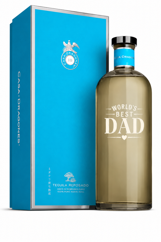 A blue box of Tequila Casa Dragones Reposado Mizunara Oak “World’s Best Dad” Deep Etched Tequila with silver accents and minimalist design makes a perfect Father’s Day gift.