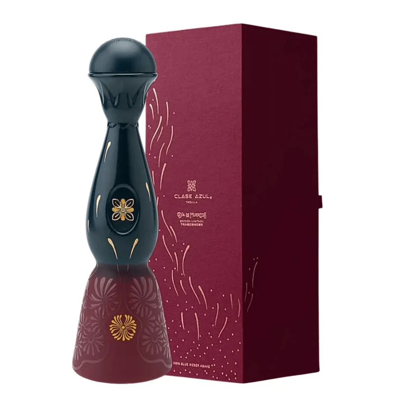 Load image into Gallery viewer, A tall, dark, decorative Clase Azul Día de Muertos Trascender 2026 Limited Edition Añejo Tequila 1L decanter with a rounded top and a flared base, featuring gold floral accents, standing next to a matching burgundy presentation box.
