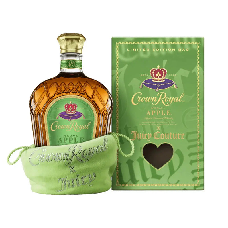 Load image into Gallery viewer, A bottle of Crown Royal Regal Apple x Juicy Couture Limited Edition is in a light green Juicy Couture bag, next to a matching green gift box with a heart-shaped window.
