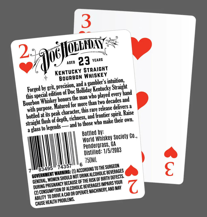 Load image into Gallery viewer, Two playing cards overlap on a gray background. The front card, the 2 of Hearts, displays a label for Doc Holliday 23 Year Kentucky Straight Bourbon Whiskey. The 4 of Hearts card is behind it.
