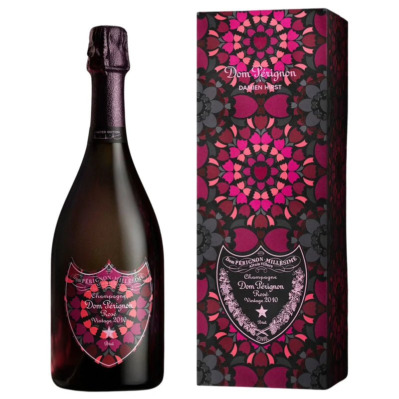 Load image into Gallery viewer, Dom Pérignon Rosé Vintage 2010 Damien Hirst Limited Edition bottle and its matching rectangular gift box, both featuring a dark, kaleidoscopic floral pattern on their labels and packaging.

