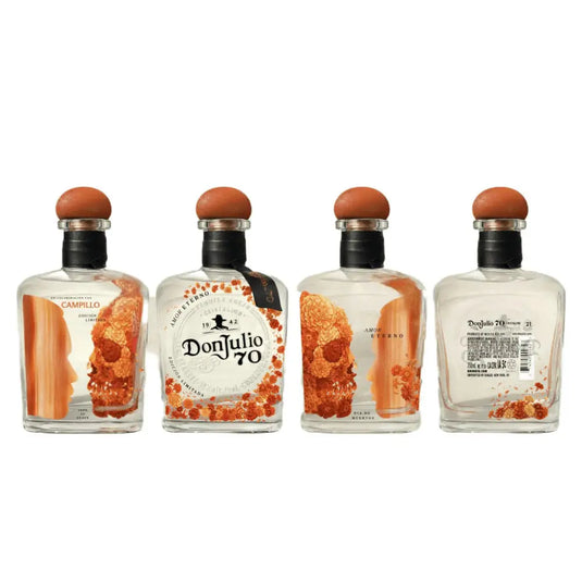 Four Don Julio Tequila 70 Cristalino Añejo Day of the Dead 2026 Limited Edition (Pre-Order) bottles are arranged in a row, each showing a unique side with orange decorative accents and bold orange-capped tops.