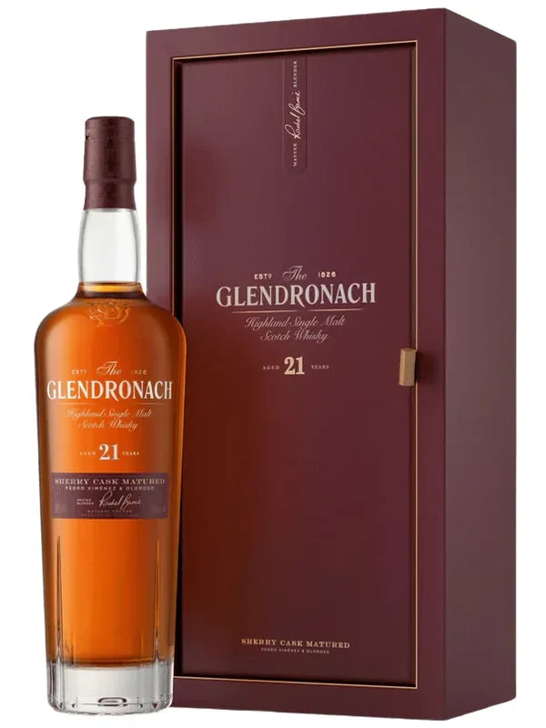 Load image into Gallery viewer, A bottle of The GlenDronach 21 Year Highland Single Malt Scotch Whisky Sherry Cask Matured by Glendronach is positioned next to its matching maroon display box, both adorned with gold and white label text and refined detailing.
