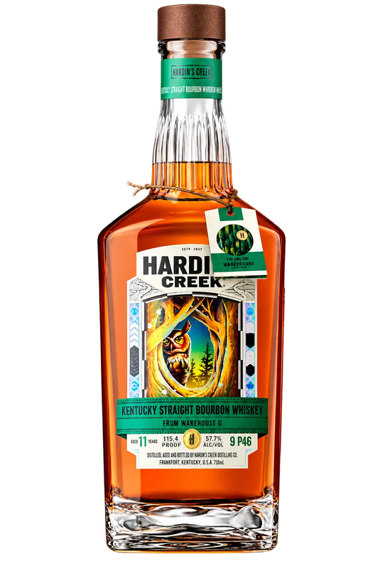 A bottle of Hardin’s Creek Warehouse Series The Owl One 11 Year Barrel Proof Bourbon Whiskey with an owl illustration on the label and a hanging tag.
