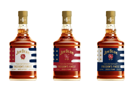 Three Jim Beam bourbon whiskey bottles with patriotic red, white, and blue labels are lined up against a light gray background.