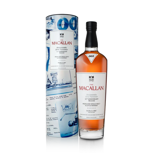 A bottle of The Macallan 007 Diamonds Are Forever 55th Anniversary Release Single Malt Scotch Whisky stands next to its blue James Bond-themed cylindrical box, both featuring The Macallan branding.