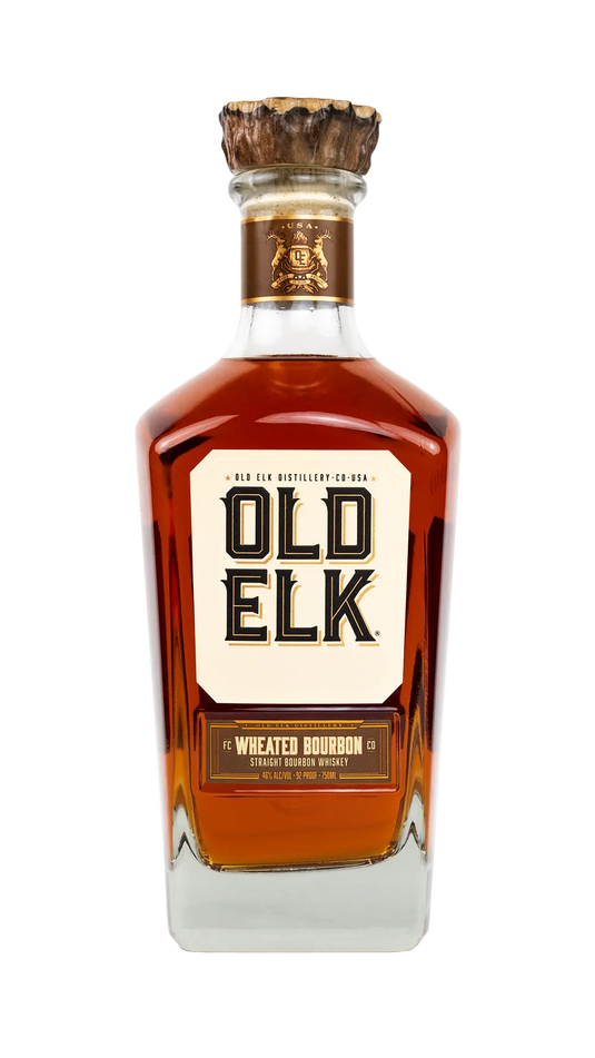 A bottle of Old Elk Bourbon’s Slow Cut Wheated Bourbon Straight Bourbon Whiskey, featuring a gold and white label, a wooden cap, and rich amber liquid inside, set against a plain white background—a perfect choice for those seeking a smooth sipping bourbon.