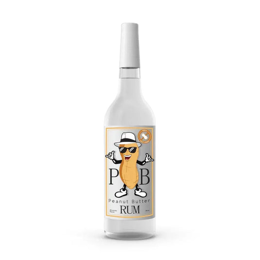 PB Rum by 19th Hole Spirits comes in a clear bottle with a label showing a cartoon peanut wearing sunglasses, a white hat, and a smile between the letters P and B. The text reads Peanut Butter Rum—perfect for dessert cocktails.