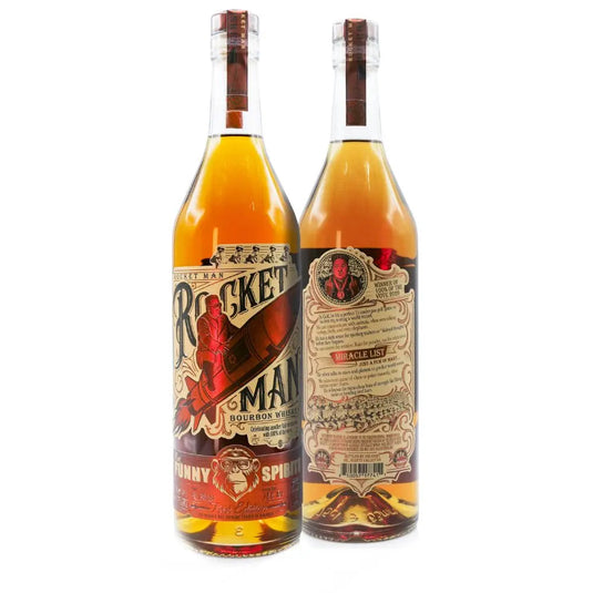 Two bottles of Rocket Man Bourbon Whiskey by Rocket Man are shown—one highlights the vintage-style rocket label, while the other displays the detailed back label. Both limited-edition bottles showcase the golden whiskey inside.