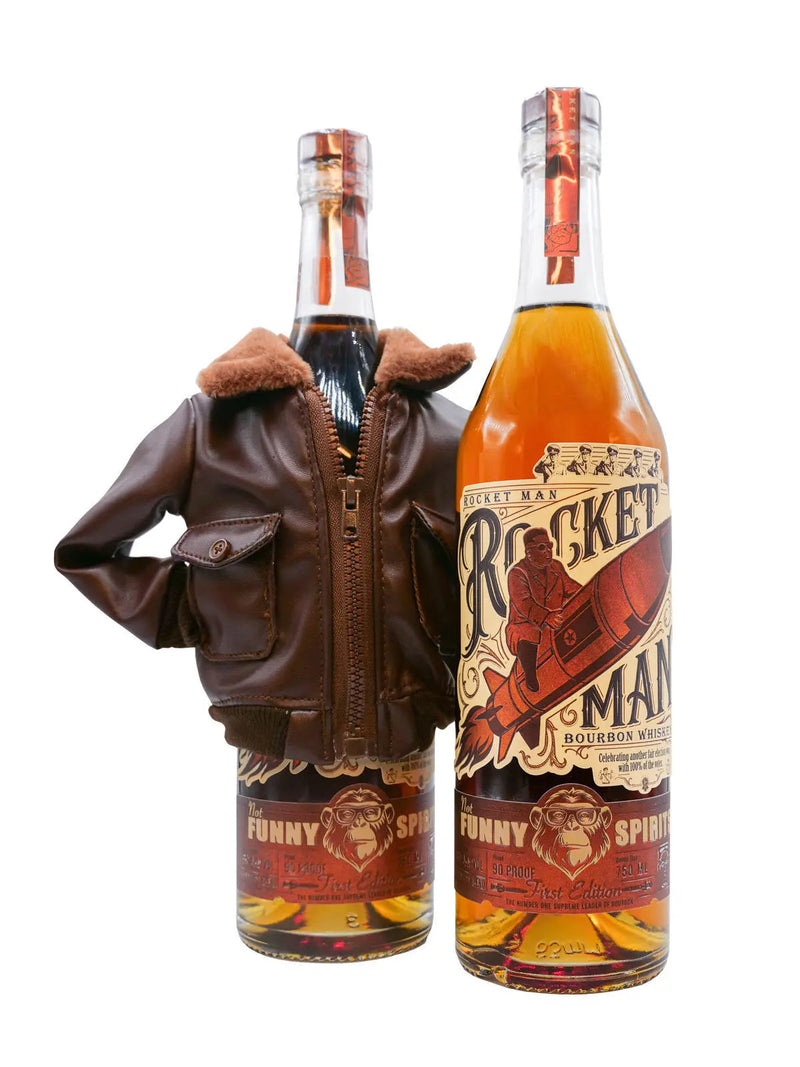 Load image into Gallery viewer, Two collectible bottles of Rocket Man Bourbon Whiskey from the Rocket Man brand stand upright against a white background—one dressed in a brown aviator jacket and the other featuring a vintage-style label with a man riding a rocket. These rocket-themed bourbon bottles evoke both nostalgia and adventure.
