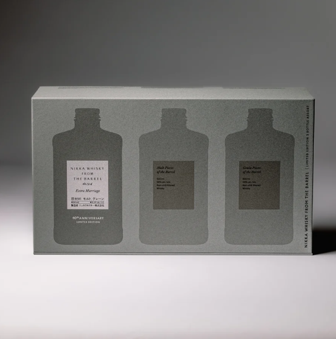 Load image into Gallery viewer, A rectangular gray box labeled "Nikka From The Barrel Extra Marriage Gift Set" by Nikka features silhouettes of three bottles, with extra detail on the center one. Soft lighting casts gentle shadows behind this Japanese whisky collector’s set.
