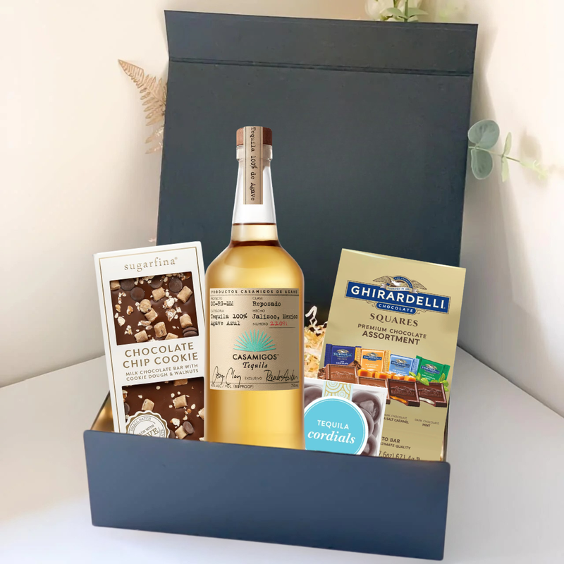 Load image into Gallery viewer, The Premium Tequila Gift Box by Main Street Liquor includes Casamigos tequila, Sugarfina chocolate chip cookie bites, Ghirardelli chocolate squares, and tequila cordials, all beautifully presented in a sleek black box.
