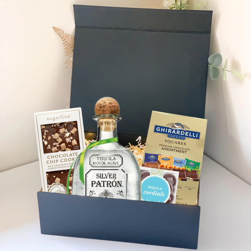 Load image into Gallery viewer, The Premium Tequila Gift Box by Main Street Liquor includes Patrón Silver, gourmet chocolate chip cookies, Ghirardelli chocolate squares, and tequila-flavored cordials in a sleek black box.
