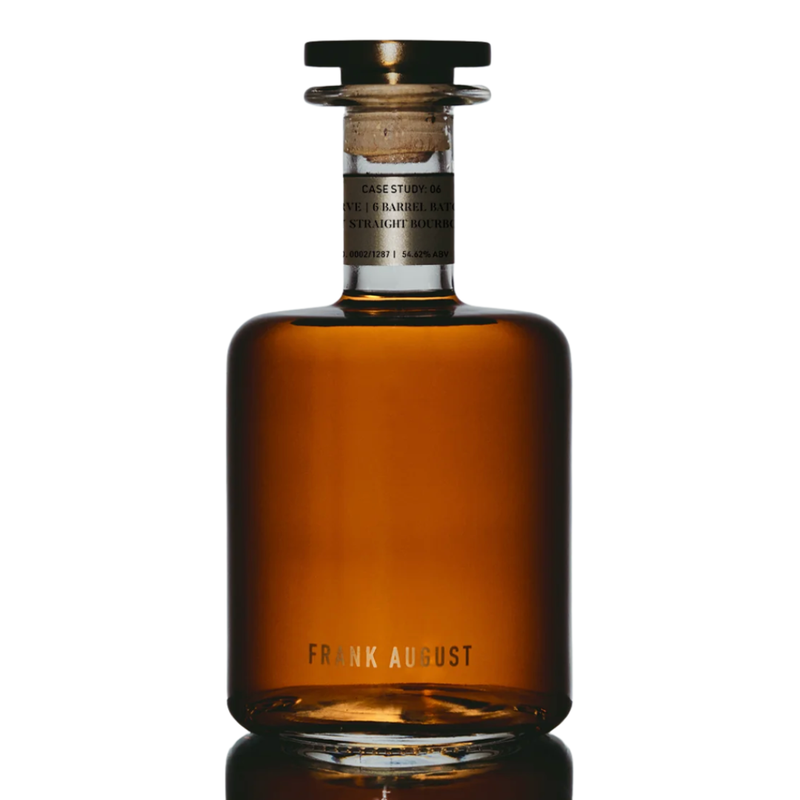 Load image into Gallery viewer, A clear glass bottle of Frank August Case Study: 06 Legacy Reserve Kentucky Straight Bourbon Whiskey, with amber liquid, a short neck, round wooden stopper, &quot;Frank August&quot; at the base, and a small label near the top.

