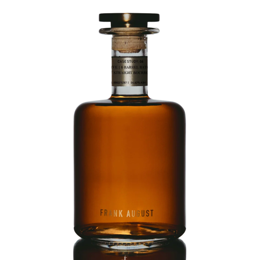 A clear glass bottle of Frank August Case Study: 06 Legacy Reserve Kentucky Straight Bourbon Whiskey, with amber liquid, a short neck, round wooden stopper, 