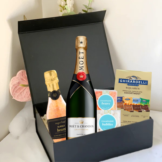 The Premium Champagne Gift Box by Main Street Liquor includes a Moët & Chandon bottle, small bubbles bottle, Sugarfina champagne gummy bears, champagne bubbles candies, and Ghirardelli chocolates—a perfect luxury gift.