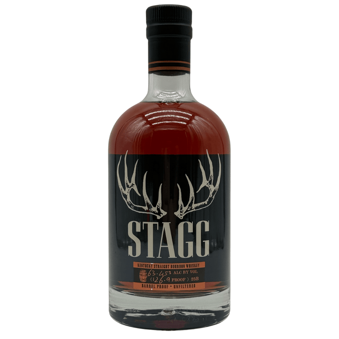 A bottle of Buffalo Trace Stagg Kentucky Straight Bourbon Whiskey Batch 25B 126.9 Proof features a dark label with antlers above bold STAGG text and holds rich amber bourbon for a robust, full-flavored barrel proof experience.