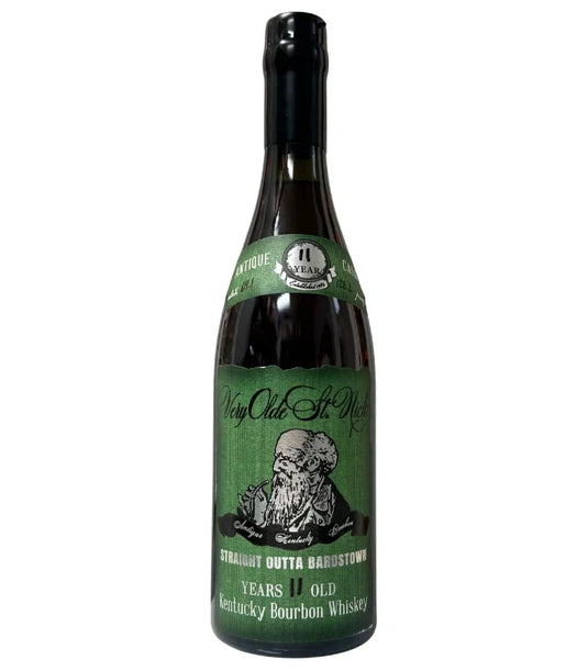 A bottle of Olde St. Nick’s Very Olde St. Nick Ancient Cask Straight Outta Bardstown 11 Year Bourbon with a green label featuring an elderly man illustration, black cap, and white and silver Kentucky bourbon details.
