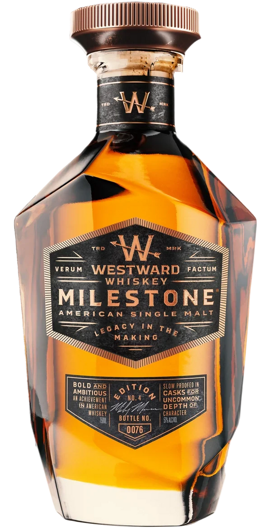 A bottle of Westward Whiskey Milestone Edition No. 4 American Single Malt (Pre-Order), a limited release from Westward, features a striking geometric design with amber liquid visible inside and showcases detailed labeling along with signature Westward branding.