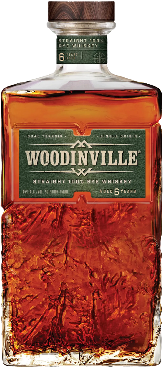 A bottle of Woodinville Straight Rye Whiskey, expertly hand-crafted and aged 6 years at a renowned Washington distillery. The label features a green background with white and gold text, and the whiskey itself displays a rich amber hue.
