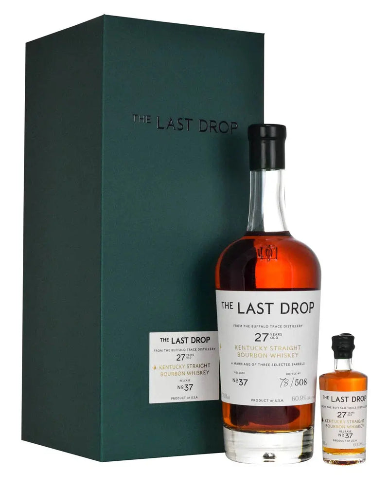 Load image into Gallery viewer, A large and small bottle of The Last Drop 27 Year-Old Kentucky Straight Bourbon Whiskey Release No. 37 by Buffalo Trace stand beside a dark green box emblazoned with THE LAST DROP.
