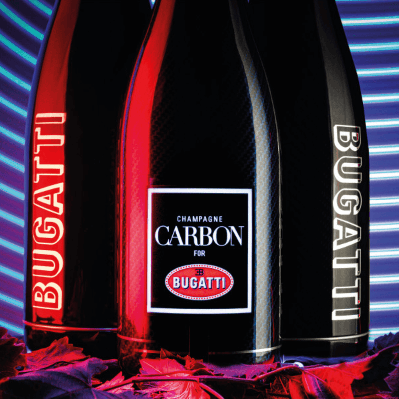 Load image into Gallery viewer, Champagne CARBON Bugatti ƎB.01 | Luminous Edition Limitée Sleeve | Vintage 2002 - Main Street Liquor
