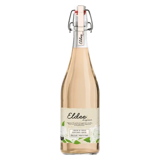 A clear glass bottle of Eldee Elderflower Liqueur, featuring a pale pink hue, a swing-top closure, and a label with a botanical illustration of elderflowers.
