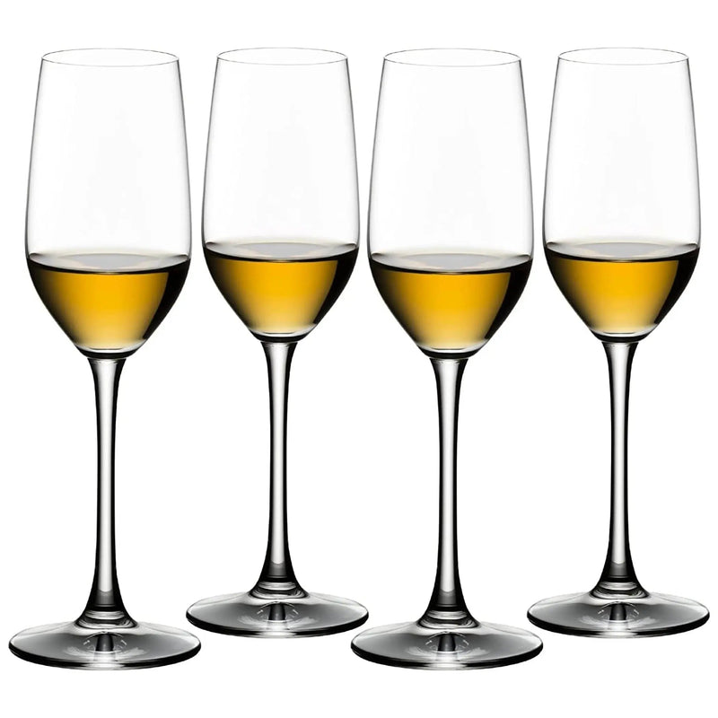 Load image into Gallery viewer, Four clear Riedel Tequila Set of 4 Sniffer Glasses, each partially filled with a golden-yellow liquid, are arranged side by side on a white background, perfectly showcasing the vibrant hue of premium tequila.
