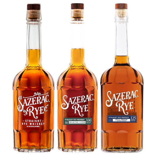 The Sazerac Rye Whiskey Bundle by Sazerac features three bottles, each with a red, green, or blue label, showcasing different types or proofs. All bottles contain amber whiskey.