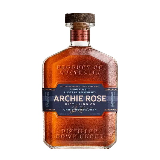 A square glass bottle of Archie Rose Single Malt Australian Whisky with a cork stopper and a dark blue label featuring the product name and a signature.