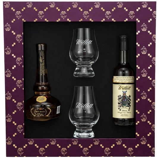 The Willett Family Estate 50ml Gift Pack includes two bottles of Willett whiskey and two Willet Glencairn glasses, all elegantly presented in a purple box with gold patterns.