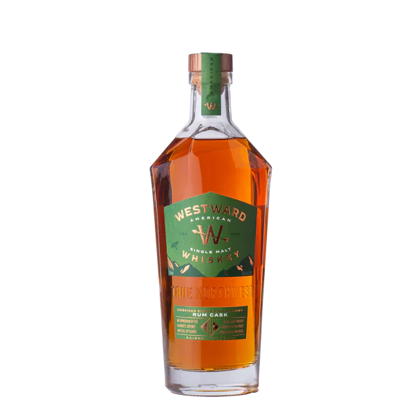 Load image into Gallery viewer, A bottle of Westward American Single Malt Rum Cask by Westward, with a green and gold label, wooden cap, and amber whiskey inside, is shown against a plain white background.
